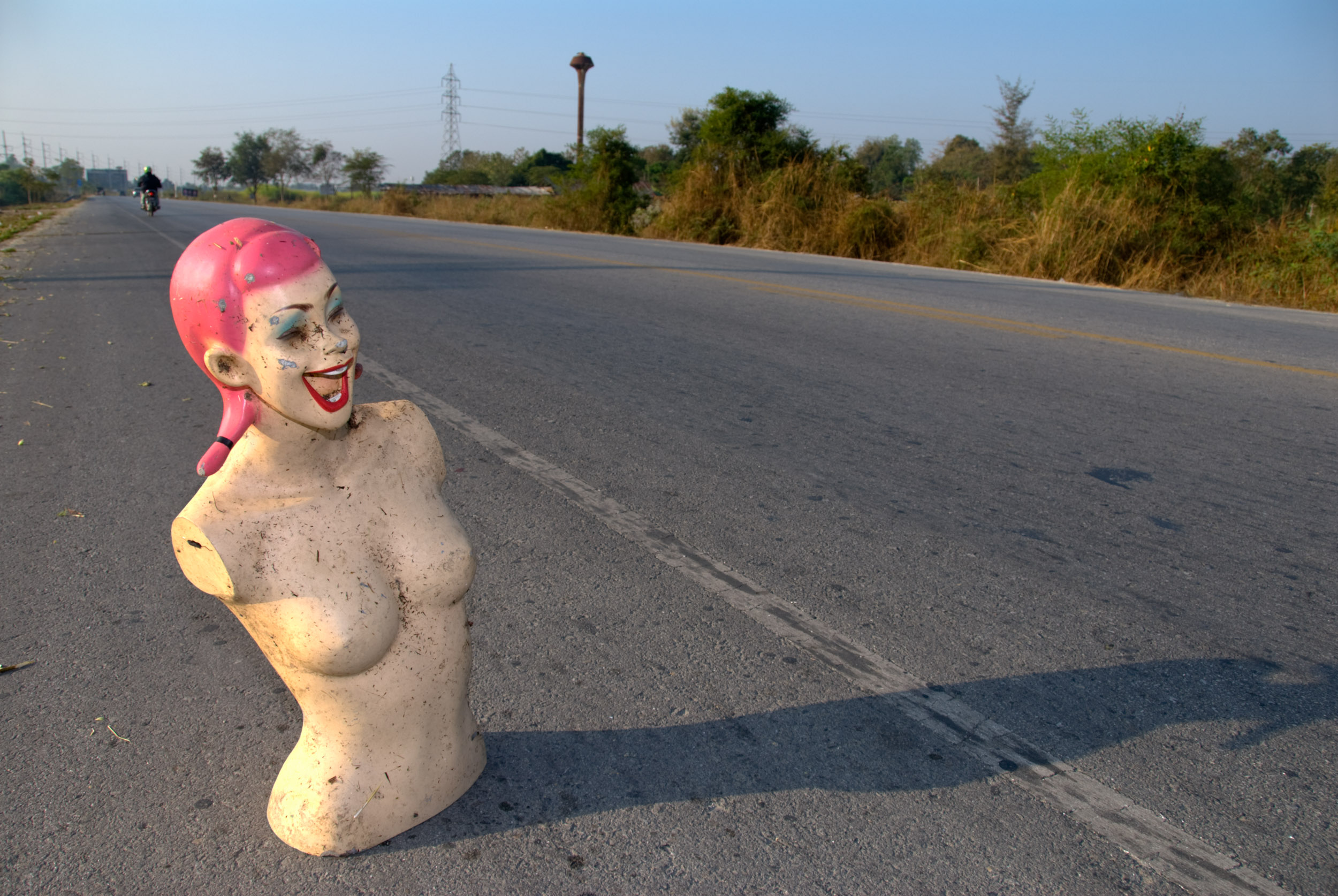 dummy on the road side with side lighting and fill flash.