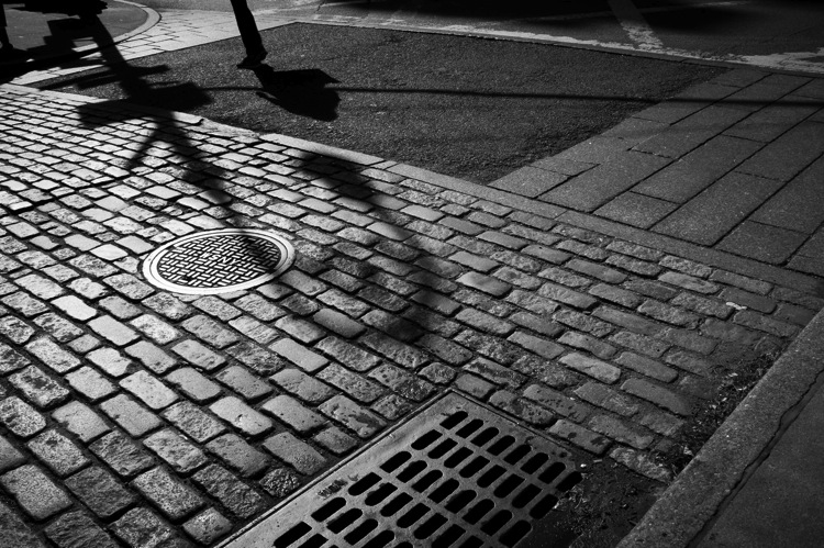 shadows on the cobblestones