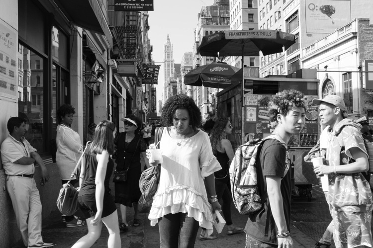 woman walking through the crowd