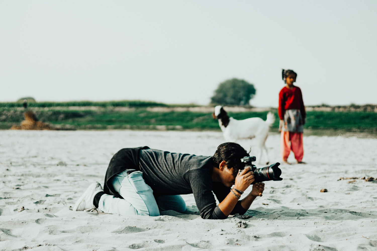 person getting down on the ground for sharp images