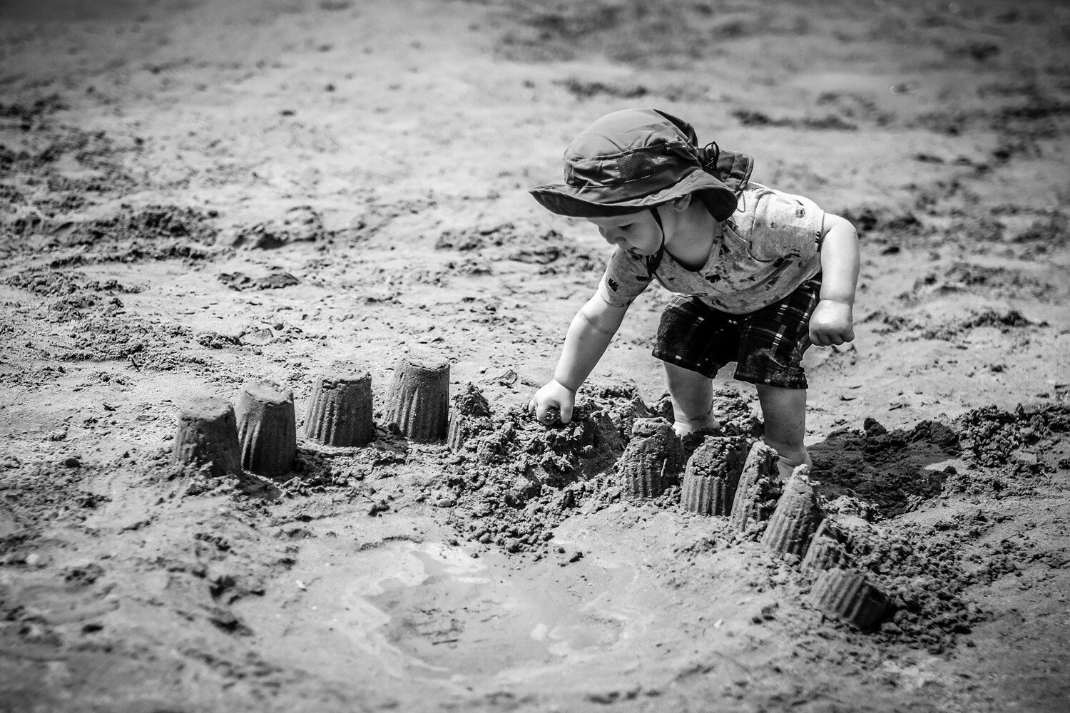 child building sandcastles